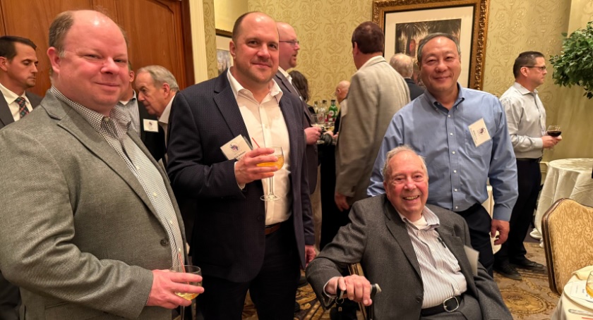 At left, Tom Kinlin of Shamrock Technologies, Rick Deisner of IGM Resins, and Shamrock Technologies’ Bill Neuberg, seated, and Shichiu Kwan.
